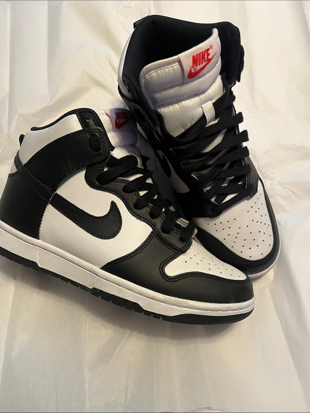 Nike Black and White High-Top Sneakers with Red Logo